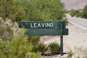 sign with word in the wild that says LEAVING. Can be used in so many different situations.